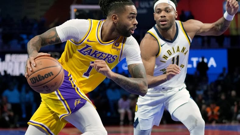 Dec 9, 2023; Las Vegas, Nevada, USA; Los Angeles Lakers guard D'Angelo Russell (1) drives against Indiana Pacers forward Bruce Brown (11) in the third quarter of the in season tournament championship final at T-Mobile Arena. Mandatory Credit: Kyle Terada-USA TODAY Sports