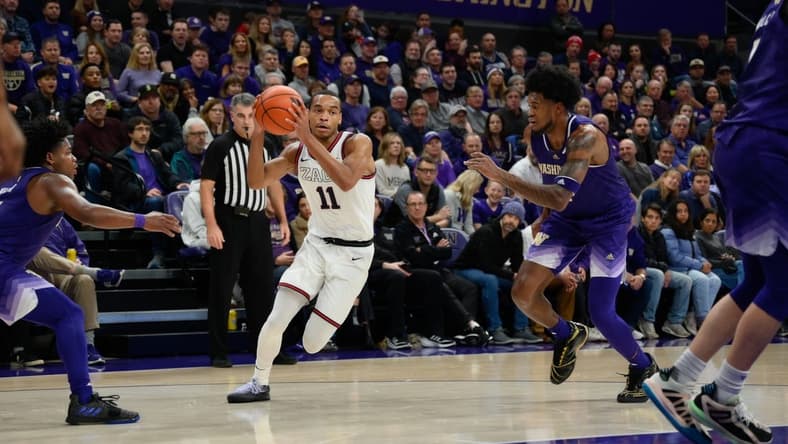 Dec 9, 2023; Seattle, Washington, USA; Gonzaga Bulldogs guard Nolan Hickman (11) drives the ball to the basket against the Washington Huskies during the second half at Alaska Airlines Arena at Hec Edmundson Pavilion. Mandatory Credit: Steven Bisig-USA TODAY Sports