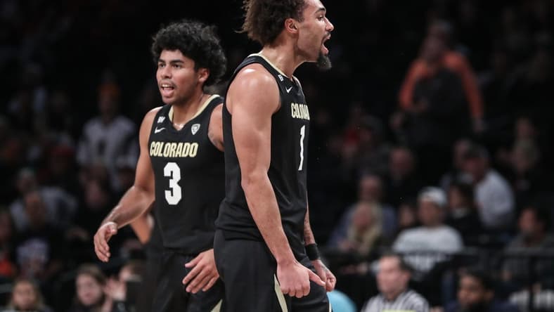 Dec 10, 2023; Brooklyn, New York, USA; Colorado Buffaloes guard J'Vonne Hadley (1) celebrates after the Miami (Fl) Hurricanes call a timeout in the first half at Barclays Center. Mandatory Credit: Wendell Cruz-USA TODAY Sports
