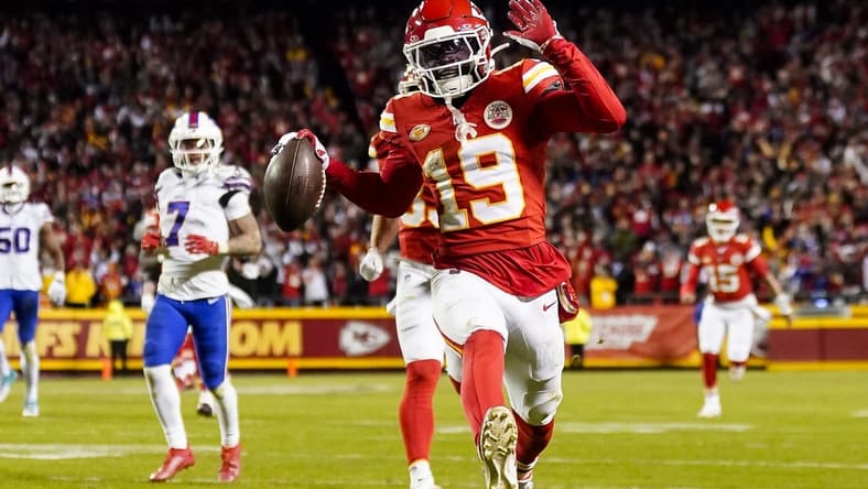 Dec 10, 2023; Kansas City, Missouri, USA; Kansas City Chiefs wide receiver Kadarius Toney (19) scores a touchdown during the second half against the Buffalo Bills at GEHA Field at Arrowhead Stadium. The play would be called back due to an offensive penalty. Mandatory Credit: Jay Biggerstaff-USA TODAY Sports