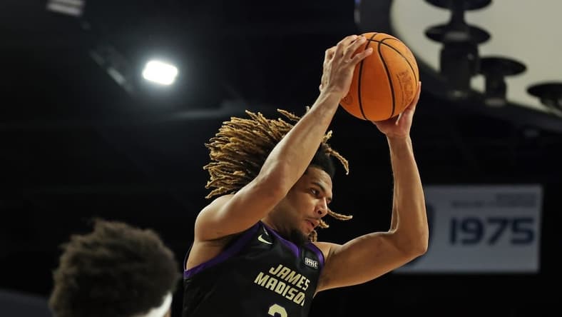 Dec 9, 2023; Norfolk, Virginia, USA; James Madison Dukes forward T.J. Bickerstaff (3) grabs a rebound against the Old Dominion Monarchs at Chartway Arena at the Ted Constant Convocation Center. Mandatory Credit: Peter Casey-USA TODAY Sports