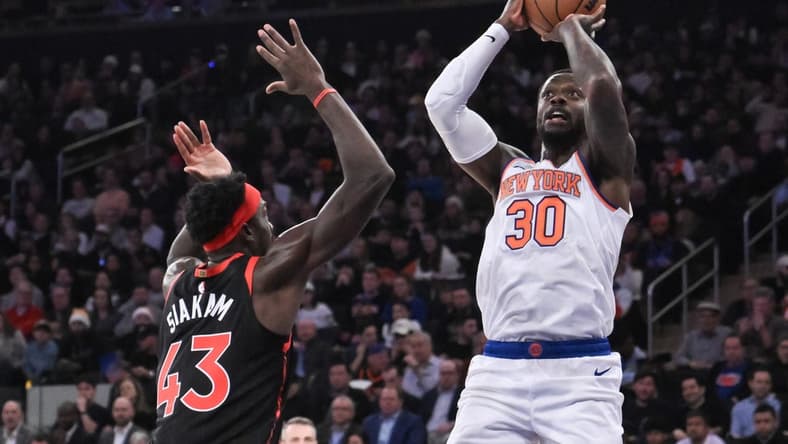 Dec 11, 2023; New York, New York, USA; New York Knicks forward Julius Randle (30) shoots the ball while being defended by Toronto Raptors forward Pascal Siakam (43) during the first quarter at Madison Square Garden. Mandatory Credit: John Jones-USA TODAY Sports