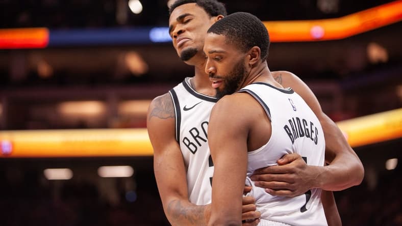 Dec 11, 2023; Sacramento, California, USA; Brooklyn Nets center Nic Claxton (33) and forward Mikal Bridges (1) embrace after a called foul during the fourth quarter against the Sacramento Kings at Golden 1 Center. Mandatory Credit: Ed Szczepanski-USA TODAY Sports