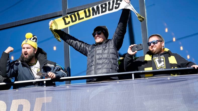 Dec 12, 2023; Columbus, OH, USA; Columbus Crew fans cheer as they watch a parade celebrating their 2023 MLS Cup victory at Lower.com Field.