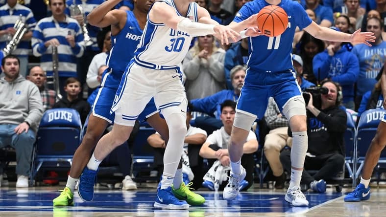 Dec 12, 2023; Durham, North Carolina, USA; Duke Blue Devils center Kyle Filipowski (30) throws a pass during the first half against the Hofstra Bison at Cameron Indoor Stadium. Mandatory Credit: Rob Kinnan-USA TODAY Sports