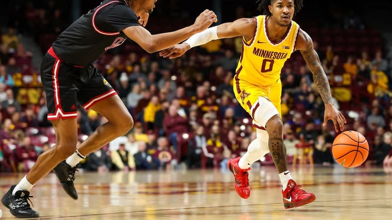 Dec 12, 2023; Minneapolis, Minnesota, USA; Minnesota Golden Gophers guard Elijah Hawkins (0) works around IUPUI Jaguars guard Kidtrell Blocker (8) during the first half at Williams Arena. Mandatory Credit: Matt Krohn-USA TODAY Sports