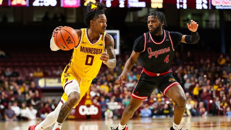 Dec 12, 2023; Minneapolis, Minnesota, USA; Minnesota Golden Gophers guard Elijah Hawkins (0) drives to the basket as IUPUI Jaguars guard Bryce Monroe (4) defends during the first half at Williams Arena. Mandatory Credit: Matt Krohn-USA TODAY Sports
