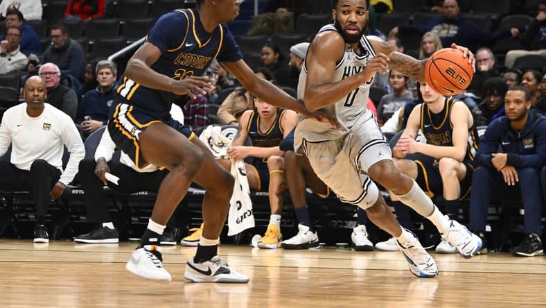 Dec 12, 2023; Washington, District of Columbia, USA; Georgetown Hoyas guard Dontrez Styles (0) dribbles past Coppin State Eagles forward Toto Fagbenle (20) during the first half at Capital One Arena. Mandatory Credit: Brad Mills-USA TODAY Sports