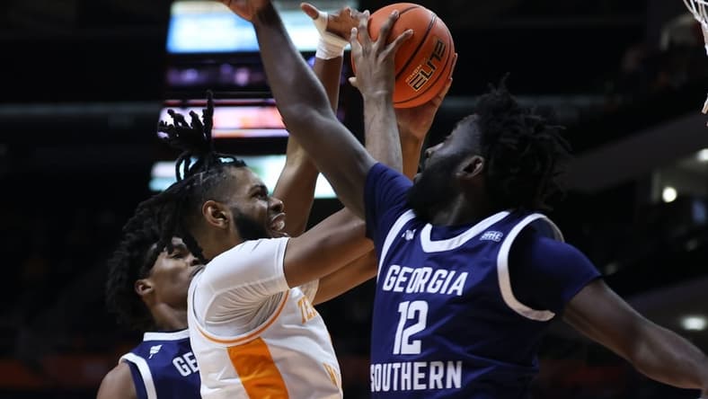 Dec 12, 2023; Knoxville, Tennessee, USA; Tennessee Volunteers forward Jonas Aidoo (0) goes to the basket against Georgia Southern Eagles guard Tyren Moore (12) at Food City Center at Thompson-Boling Arena. Mandatory Credit: Randy Sartin-USA TODAY Sports