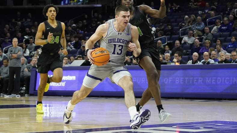 Dec 13, 2023; Evanston, Illinois, USA; Chicago State Cougars guard Wesley Cardet Jr. (1) defends Northwestern Wildcats guard Brooks Barnhizer (13) during the first half at Welsh-Ryan Arena. Mandatory Credit: David Banks-USA TODAY Sports