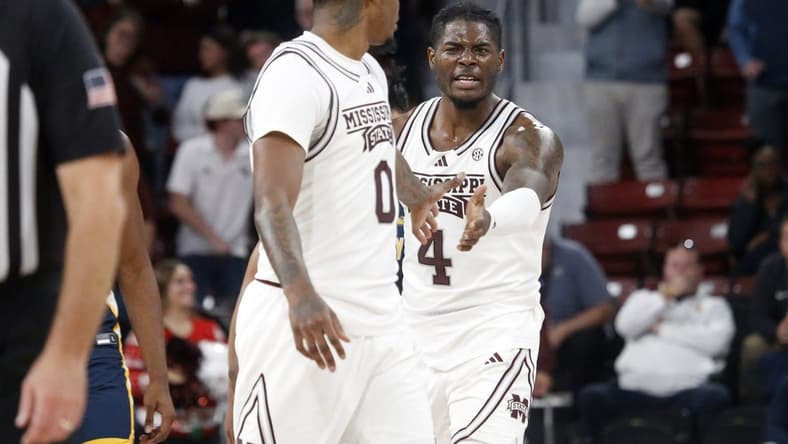 Dec 13, 2023; Starkville, Mississippi, USA; Mississippi State Bulldogs forward Cameron Matthews (4) reacts with Mississippi State Bulldogs forward D.J. Jeffries (0) during the second half against the Murray State Racers at Humphrey Coliseum. Mandatory Credit: Petre Thomas-USA TODAY Sports