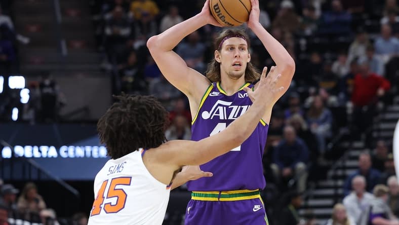 Dec 13, 2023; Salt Lake City, Utah, USA; Utah Jazz forward Kelly Olynyk (41) looks to pass the ball against New York Knicks center Jericho Sims (45) during the third quarter at Delta Center. Mandatory Credit: Rob Gray-USA TODAY Sports