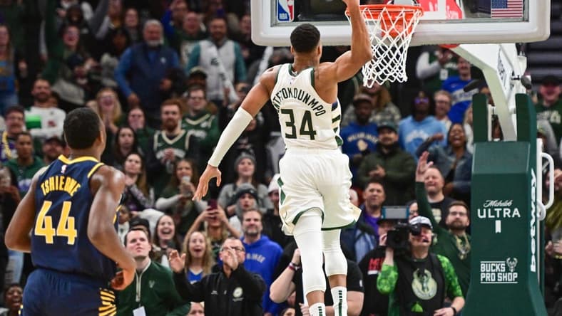 Dec 13, 2023; Milwaukee, Wisconsin, USA; Milwaukee Bucks forward Giannis Antetokounmpo (34) scores 64 points in the fourth quarter against the Indiana Pacers to set a team record for most points scored in a game at Fiserv Forum. Mandatory Credit: Benny Sieu-USA TODAY Sports
