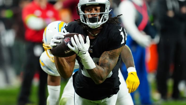 Dec 14, 2023; Paradise, Nevada, USA; Las Vegas Raiders wide receiver Jakobi Meyers (16) makes a catch for a touchdown against the Los Angeles Chargers in the first quarter at Allegiant Stadium. Mandatory Credit: Stephen R. Sylvanie-USA TODAY Sports
