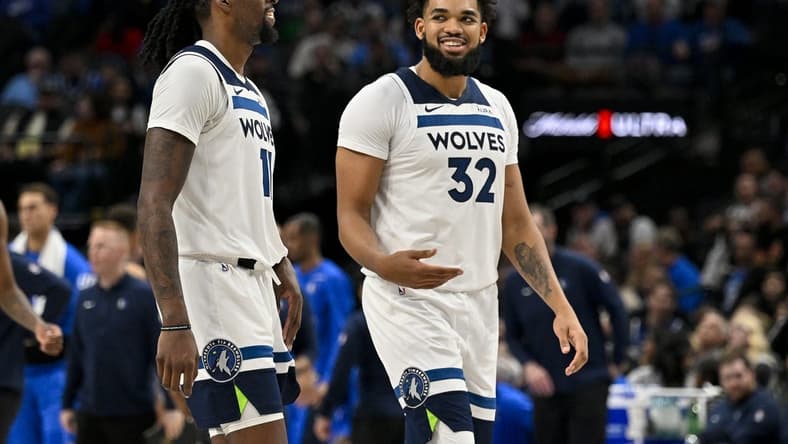 Dec 14, 2023; Dallas, Texas, USA; Minnesota Timberwolves center Naz Reid (11) and center Karl-Anthony Towns (32) walk off the court during the second half against the Dallas Mavericks at the American Airlines Center. Mandatory Credit: Jerome Miron-USA TODAY Sports