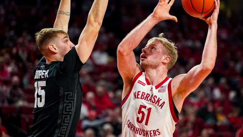 Dec 10, 2023; Lincoln, Nebraska, USA; Nebraska Cornhuskers forward Rienk Mast (51) shoots the ball against Michigan State Spartans center Carson Cooper (15) during the first half at Pinnacle Bank Arena. Mandatory Credit: Dylan Widger-USA TODAY Sports