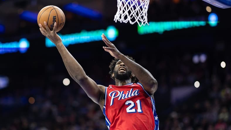Dec 15, 2023; Philadelphia, Pennsylvania, USA; Philadelphia 76ers center Joel Embiid (21) drives for a shot against the Detroit Pistons during the first quarter at Wells Fargo Center. Mandatory Credit: Bill Streicher-USA TODAY Sports