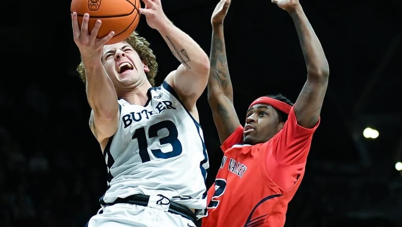 Dec 15, 2023; Indianapolis, Indiana, USA; Butler Bulldogs guard Finley Bizjack (13) goes to the basket against Saginaw Valley State Cardinals guard Curtis Jackson (2) during the first half at Hinkle Fieldhouse. Mandatory Credit: Robert Goddin-USA TODAY Sports