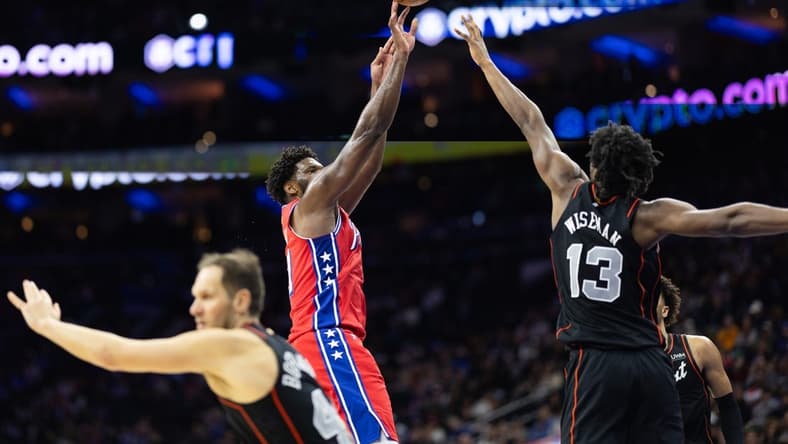 Dec 15, 2023; Philadelphia, Pennsylvania, USA; Philadelphia 76ers center Joel Embiid (21) shoots past Detroit Pistons center James Wiseman (13) during the second quarter at Wells Fargo Center. Mandatory Credit: Bill Streicher-USA TODAY Sports