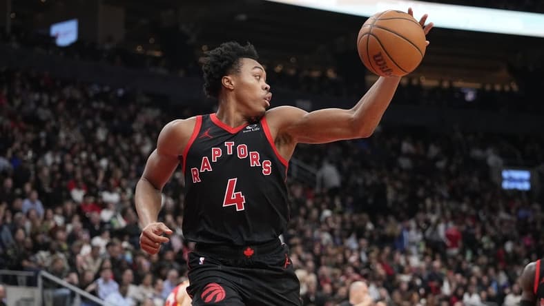 Dec 15, 2023; Toronto, Ontario, CAN; Toronto Raptors forward Scottie Barnes (4) grabs a rebound against the Atlanta Hawks during the first half at Scotiabank Arena. Mandatory Credit: John E. Sokolowski-USA TODAY Sports
