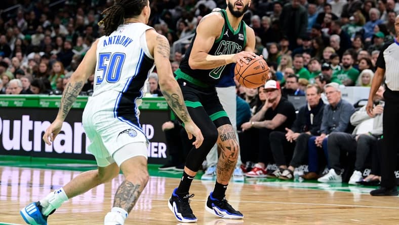 Dec 15, 2023; Boston, Massachusetts, USA; Boston Celtics forward Jayson Tatum (0) shoots the ball during the second half against the Orlando Magic at TD Garden. Mandatory Credit: Eric Canha-USA TODAY Sports