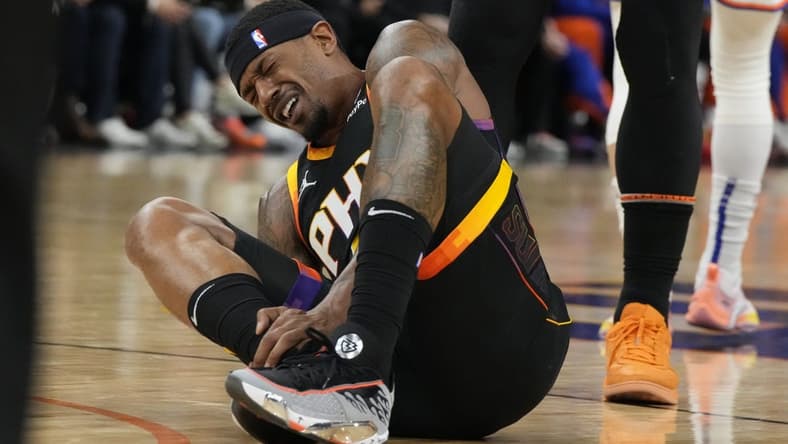 Dec 15, 2023; Phoenix, Arizona, USA; Phoenix Suns guard Bradley Beal (3) reacts after getting hurt against the New York Knicks in the first half at Footprint Center. Mandatory Credit: Rick Scuteri-USA TODAY Sports