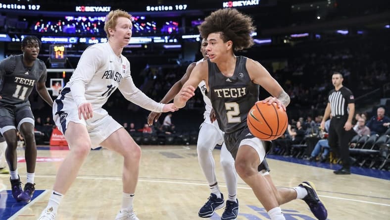 Dec 16, 2023; New York, New York, USA; Georgia Tech Yellow Jackets guard Naithan George (2) drives past Penn State Nittany Lions forward Leo O'Boyle (11) in the first half at Madison Square Garden. Mandatory Credit: Wendell Cruz-USA TODAY Sports