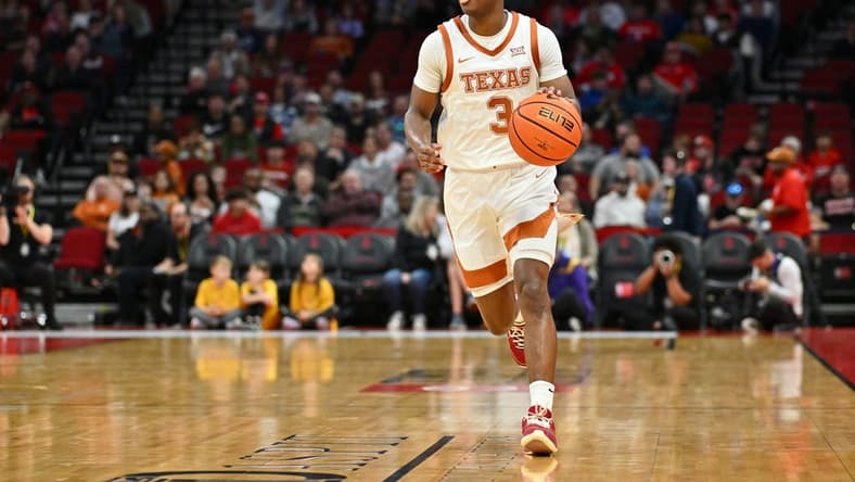 Dec 16, 2023; Houston, Texas, USA; Texas Longhorns guard Max Abmas (3) dribbles the ball against the LSU Tigers during the first half at Toyota Center. Mandatory Credit: Maria Lysaker-USA TODAY Sports