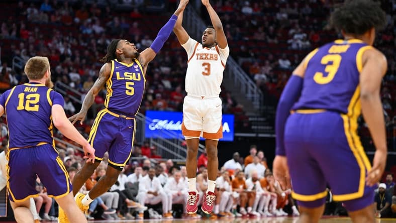 Dec 16, 2023; Houston, Texas, USA; Texas Longhorns guard Max Abmas (3) shoots the ball against LSU Tigers forward Mwani Wilkinson (5) during the first half at Toyota Center. Mandatory Credit: Maria Lysaker-USA TODAY Sports