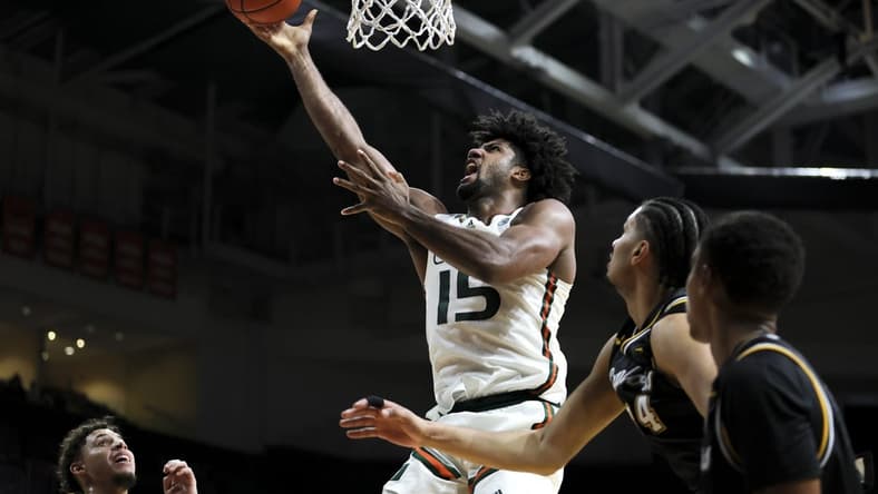 Dec 16, 2023; Coral Gables, Florida, USA; Miami Hurricanes forward Norchad Omier (15) lays up a shot against the La Salle Explorers during the second half at Watsco Center. Mandatory Credit: Sam Navarro-USA TODAY Sports