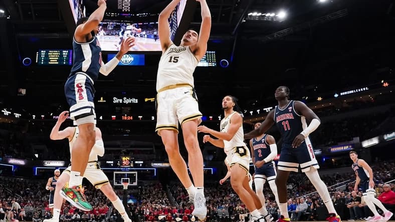 Dec 16, 2023; Indianapolis, Indiana, USA; Purdue Boilermakers center Zach Edey (15) rebounds the ball against Arizona Wildcats forward Keshad Johnson (16) during the first half at Gainbridge Fieldhouse. Mandatory Credit: Robert Goddin-USA TODAY Sports