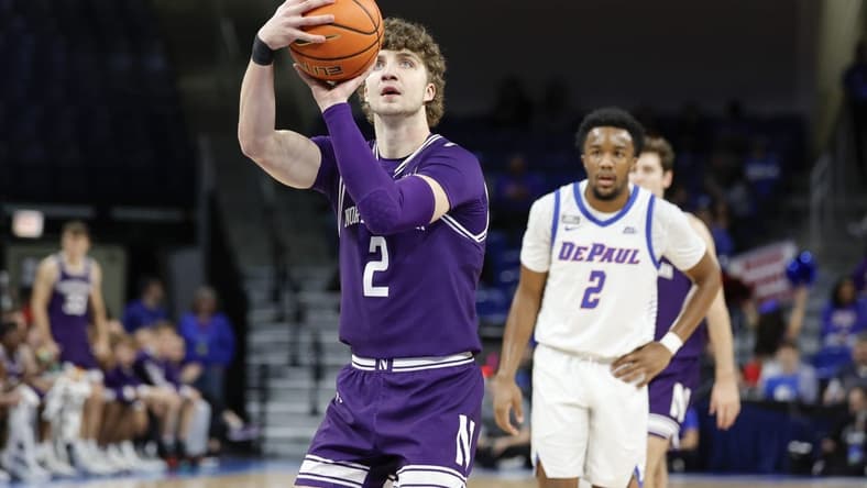 Dec 16, 2023; Chicago, Illinois, USA; Northwestern Wildcats forward Nick Martinelli (2) shoots a free throw against the DePaul Blue Demons during the first half at Wintrust Arena. Mandatory Credit: Kamil Krzaczynski-USA TODAY Sports