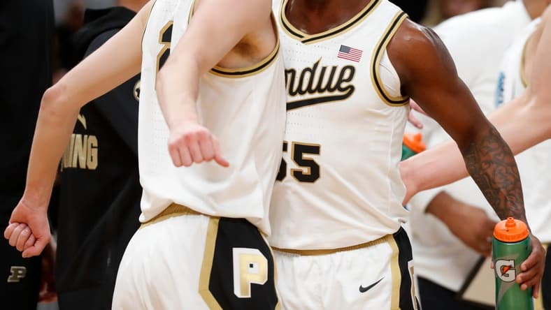 Purdue Boilermakers guard Fletcher Loyer (2) and Purdue Boilermakers guard Lance Jones (55) celebrate during a timeout during the NCAA men s basketball game against the Arizona Wildcats, Saturday, Dec. 16, 2023, at Gainbridge Fieldhouse in Indianapolis. Purdue Boilermakers won 92-84.