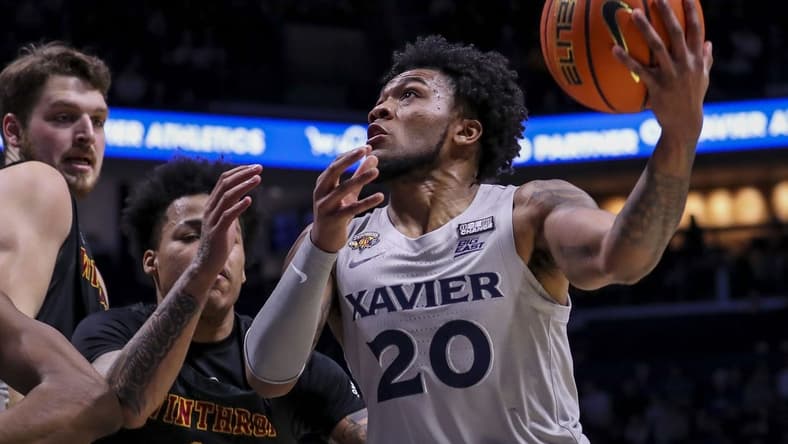 Dec 16, 2023; Cincinnati, Ohio, USA; Xavier Musketeers guard Dayvion McKnight (20) drives to the basket against the Winthrop Eagles in the first half at Cintas Center. Mandatory Credit: Katie Stratman-USA TODAY Sports