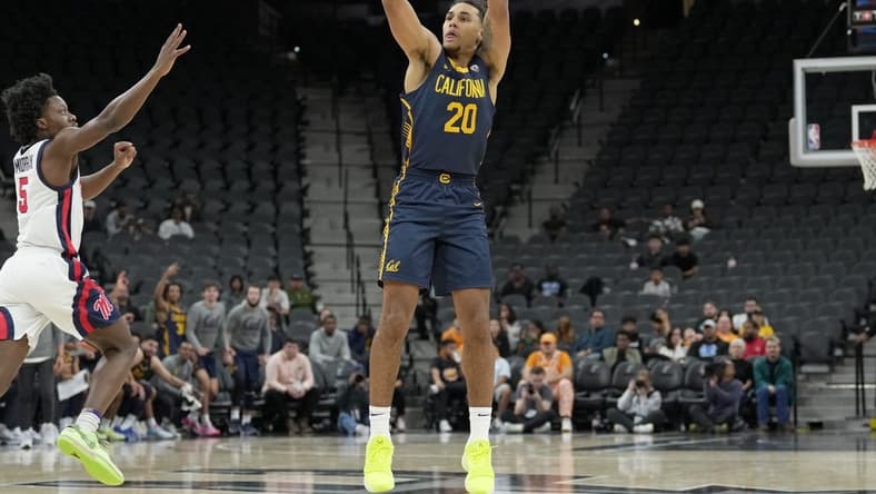 Dec 16, 2023; San Antonio, Texas, USA; California Golden Bears guard Jaylon Tyson (20) shoots in front of Mississippi Rebels guard Jaylen Murray (5) in the first half at the Frost Bank Center. Mandatory Credit: Daniel Dunn-USA TODAY Sports