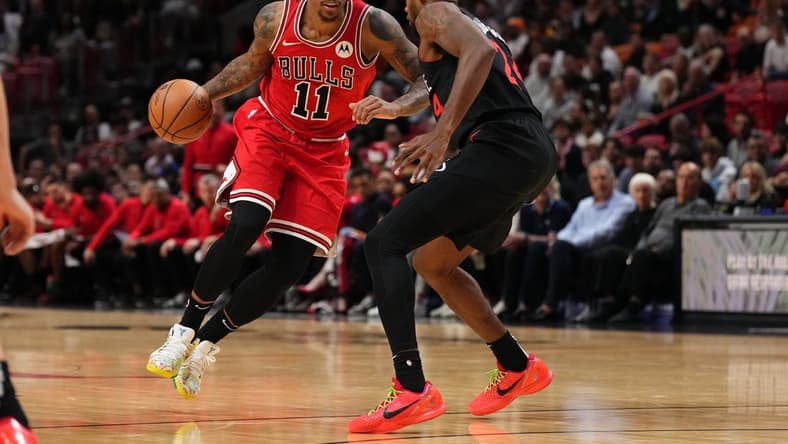 Dec 16, 2023; Miami, Florida, USA; Chicago Bulls forward DeMar DeRozan (11) drives the ball around Miami Heat forward Haywood Highsmith (24) during the first half at Kaseya Center. Mandatory Credit: Jasen Vinlove-USA TODAY Sports