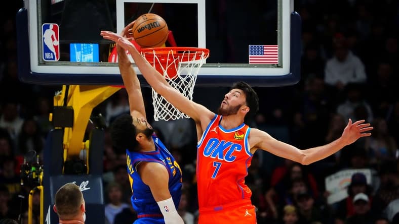 Dec 16, 2023; Denver, Colorado, USA; Denver Nuggets guard Jamal Murray (27) scores against Oklahoma City Thunder forward Chet Holmgren (7) in the first quarter at Ball Arena. Mandatory Credit: Ron Chenoy-USA TODAY Sports