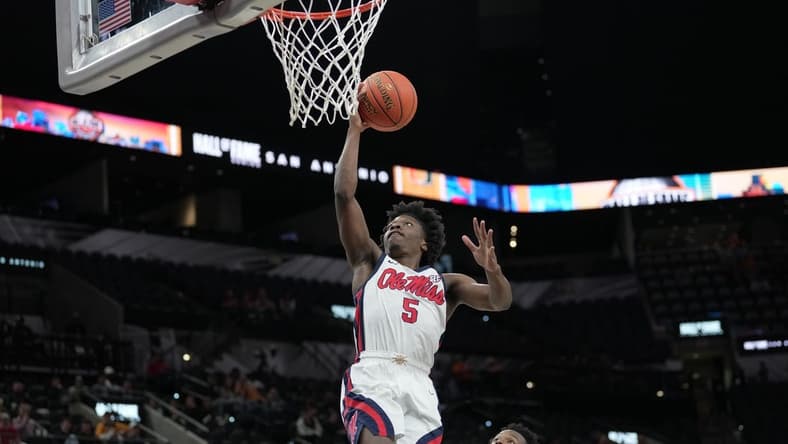 Dec 16, 2023; San Antonio, Texas, USA;  Mississippi Rebels guard Jaylen Murray (5) shoots in the second half against the California Golden Bears at the Frost Bank Center. Mandatory Credit: Daniel Dunn-USA TODAY Sports