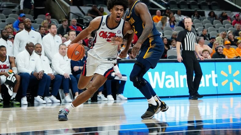 Dec 16, 2023; San Antonio, Texas, USA; Mississippi Rebels forward Jaemyn Brakefield (4) dribbles against California Golden Bears guard Jalen Celestine (32) in the second half at the Frost Bank Center. Mandatory Credit: Daniel Dunn-USA TODAY Sports