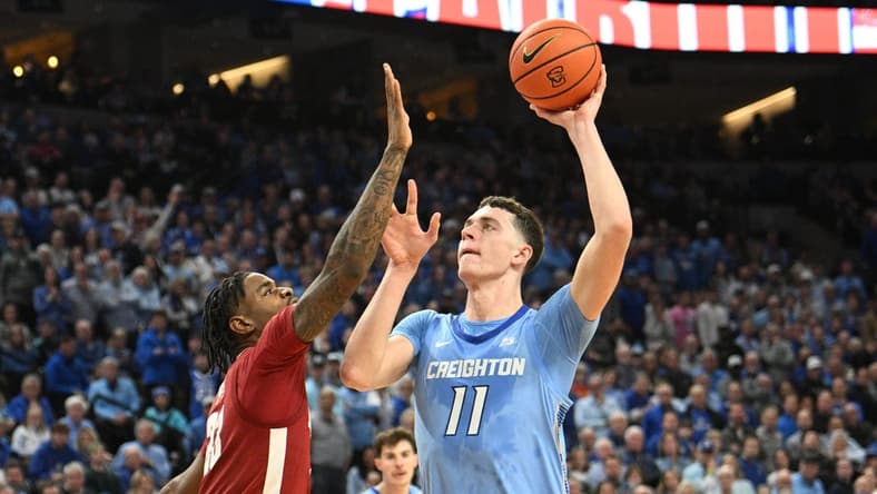 Dec 16, 2023; Omaha, Nebraska, USA; Creighton Bluejays center Ryan Kalkbrenner (11) attempts a shot against Alabama Crimson Tide forward Nick Pringle (23) in the second half at CHI Health Center Omaha. Mandatory Credit: Steven Branscombe-USA TODAY Sports