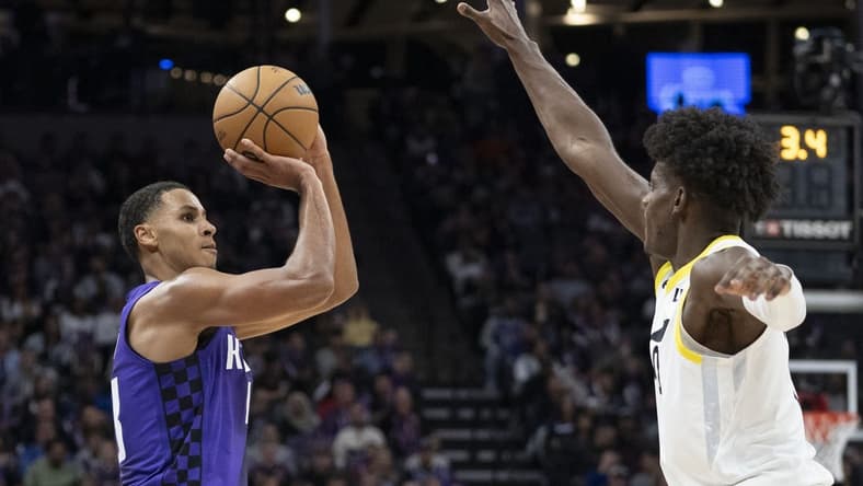 December 16, 2023; Sacramento, California, USA; Sacramento Kings forward Keegan Murray (13) shoots the basketball against Utah Jazz forward Taylor Hendricks (0) during the third quarter at Golden 1 Center. Mandatory Credit: Kyle Terada-USA TODAY Sports