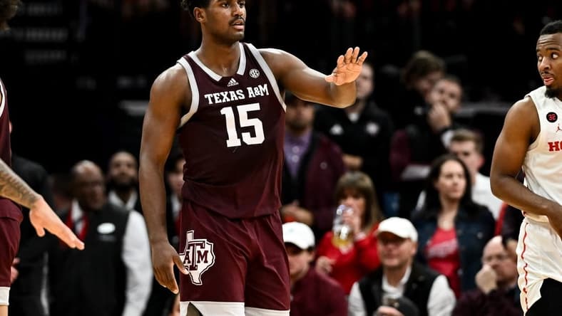 Dec 16, 2023; Houston, Texas, USA; Texas A&M Aggies forward Henry Coleman III (15) motions during a time-out in the second half against the Houston Cougars at Toyota Center. Mandatory Credit: Maria Lysaker-USA TODAY Sports