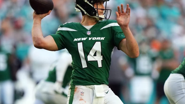 Dec 17, 2023; Miami Gardens, Florida, USA; New York Jets quarterback Trevor Siemian (14) attempts a pass against the Miami Dolphins during the second half at Hard Rock Stadium. Mandatory Credit: Jasen Vinlove-USA TODAY Sports