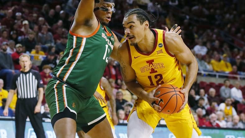 Iowa State Cyclones forward Robert Jones (12) drives to the basket around Florida A&M Rattlers forward Shannon Grant (13) during the first half of a NCAA college basketball at Hilton Coliseum on Sunday, Dec. 17, 2023, in Ames, Iowa.