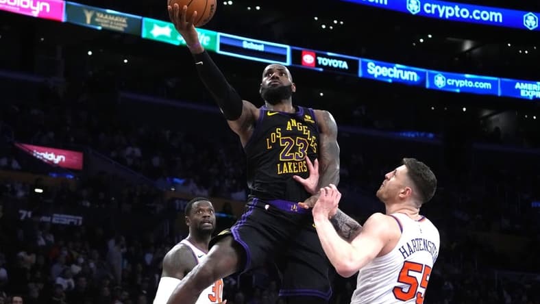 Dec 18, 2023; Los Angeles, California, USA; Los Angeles Lakers forward LeBron James (23) shoots the ball against New York Knicks center Isaiah Hartenstein (55) in the second half at Crypto.com Arena. Mandatory Credit: Kirby Lee-USA TODAY Sports