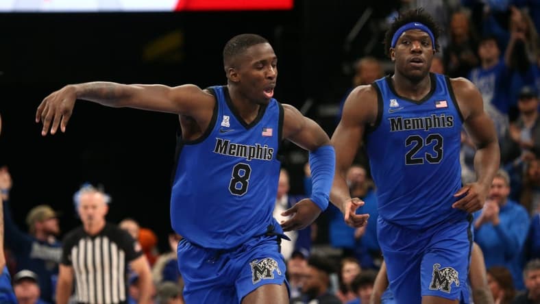 Dec 19, 2023; Memphis, Tennessee, USA; Memphis Tigers forward David Jones (8) reacts during the second half against the Virginia Cavaliers at FedExForum. Mandatory Credit: Petre Thomas-USA TODAY Sports