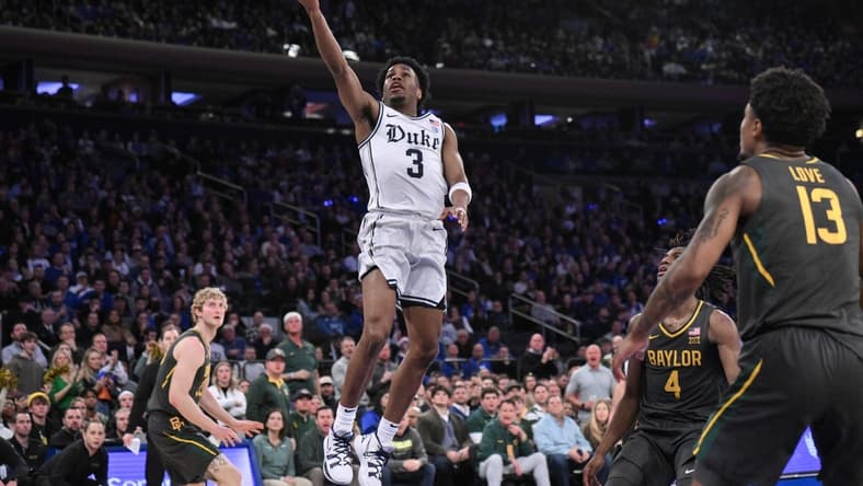 Dec 20, 2023; New York, New York, USA; Duke Blue Devils guard Jeremy Roach (3) drives to the basket as Baylor Bears guard Langston Love (13) looks on during the first half at Madison Square Garden. Mandatory Credit: John Jones-USA TODAY Sports