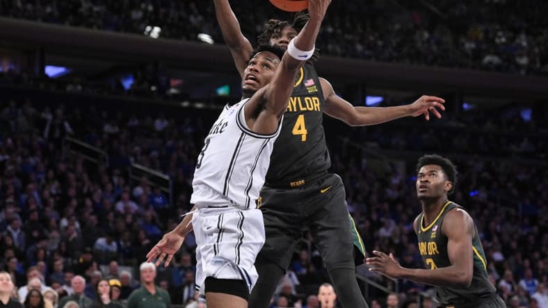 Dec 20, 2023; New York, New York, USA; Duke Blue Devils guard Jeremy Roach (3) shoots the ball as Baylor Bears guard Ja'Kobe Walter (4) defends during the first half at Madison Square Garden. Mandatory Credit: John Jones-USA TODAY Sports