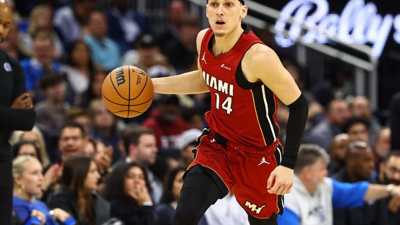 Dec 20, 2023; Orlando, Florida, USA; Miami Heat guard Tyler Herro (14) dribbles the ball against the Orlando Magic during the second quarter at KIA Center. Mandatory Credit: Kim Klement Neitzel-USA TODAY Sports