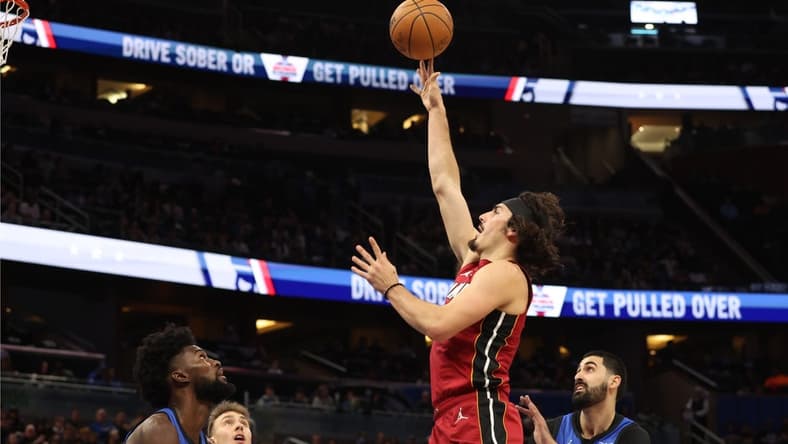 Dec 20, 2023; Orlando, Florida, USA; Miami Heat guard Jaime Jaquez Jr. (11) shoots a layup against the Orlando Magic during the first quarter at KIA Center. Mandatory Credit: Kim Klement Neitzel-USA TODAY Sports